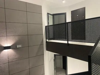 a staircase in a room with a mirror at Sielsko Anielsko Apartament in Zawoja