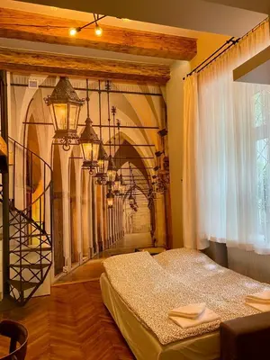a bedroom with a bed in a room at Family Apartment with mezzanine in Kraków