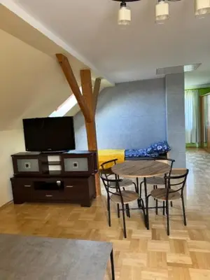 a dining room with a table and chairs and a tv at Bochnia , nocleg,noclegi, pokoje,kwatery pracownicze in Bochnia