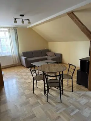 a living room with a table and chairs and a couch at Bochnia , nocleg,noclegi, pokoje,kwatery pracownicze in Bochnia