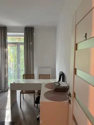 a room with a table with a phone on it at Apartamenty Cisza Krakow in Kraków
