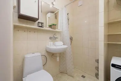 a bathroom with a toilet and a sink at Nowowiejska Cosy Studio for 6 people in Cracow by Noclegi Renters in Kraków