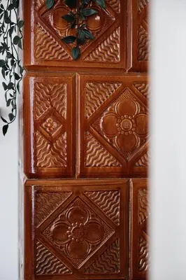a wooden door with intricate designs on it at Vintage Soul Kazimierz Old Town in Kraków