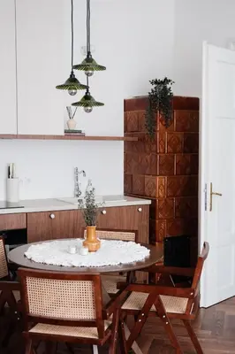 a kitchen with a table with chairs and a counter at Vintage Soul Kazimierz Old Town in Kraków