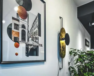 a wall with a picture and a saxophone on it at Bakelit Studio - Design hideaway - Calm, quality & location in Kraków
