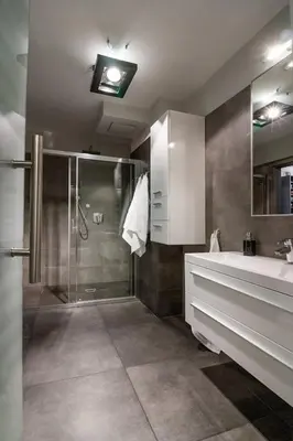 a bathroom with a shower and a sink at Large Krakow Apartment - Near Kazimierz - City Center in Kraków