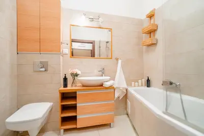 a bathroom with a sink and a tub and a toilet at Rakowicka Residence Parking Balkon By Hosty in Kraków