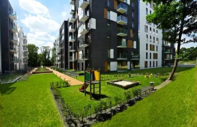 a park in front of a large building at Rakowicka Residence Parking Balkon By Hosty in Kraków