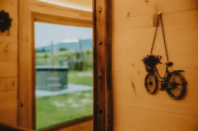 a bike hanging on the side of a wall at Góralski dom balia kominek Lawendowy Dom na Wichrowym Wzgórzu in Łętownia Dolna