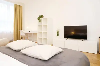 a bathroom with a toilet and a sink and a mirror at Nowy Kleparz 102 m2 with 3 Separate Bedrooms in Kraków