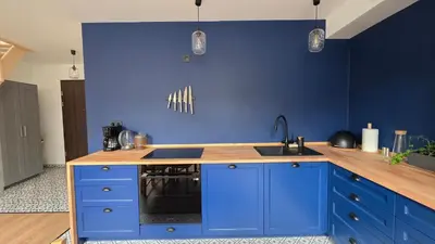 a blue kitchen with a sink and a stove at Anthracite Apartment on Felicjanek Street by CityBeat in Kraków