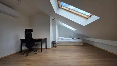 an empty hallway with a large window in a building at Anthracite Apartment on Felicjanek Street by CityBeat in Kraków