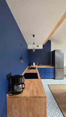 a bathroom with a shower and a tiled floor at Anthracite Apartment on Felicjanek Street by CityBeat in Kraków