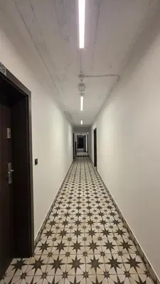a bathroom with a white toilet and a shower at Anthracite Apartment on Felicjanek Street by CityBeat in Kraków