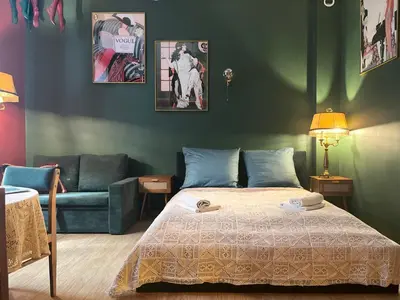 a bedroom with a bed and a couch at Cozy Apartment Inspiro, Cracow Old Town in Kraków