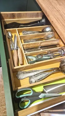 a drawer filled with lots of different types of scissors at Cozy Apartment Inspiro, Cracow Old Town in Kraków