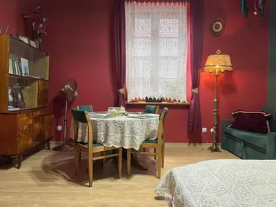 a dining room with a table and chairs at Cozy Apartment Inspiro, Cracow Old Town in Kraków