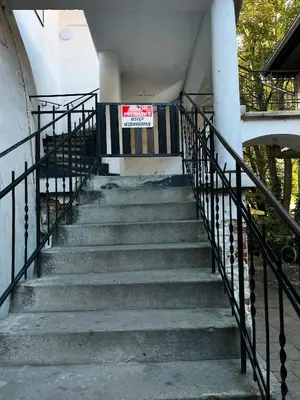 a set of stairs with a sign on it at Cozy Apartment Inspiro, Cracow Old Town in Kraków