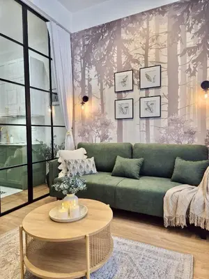 three beds in a room with green walls at Wawel Square Residence in Kraków