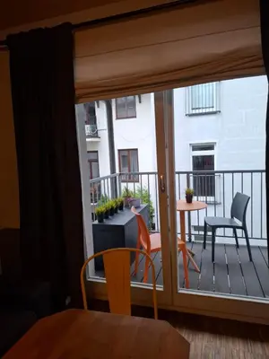 a view of a balcony with a table and chairs at Różana Near Wawel Castle in Kraków