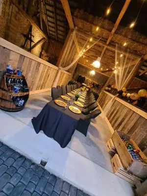 an overhead view of a table and chairs in a room at Dom w zaciszu stodoły