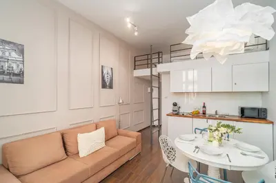 a living room with a couch and a table at Grzegórzki Studio - Entresol, Top Location - by Rentujemy in Kraków
