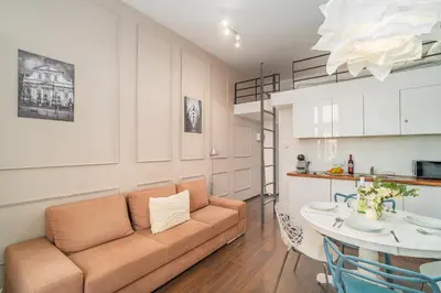 a living room with a couch and a table at Grzegórzki Studio - Entresol, Top Location - by Rentujemy in Kraków