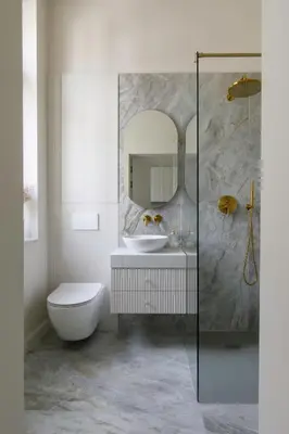 a bathroom with a sink and a mirror at Wawel View I Koletek 17 in Kraków