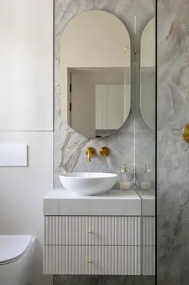 a bathroom with a sink and a mirror at Wawel View I Koletek 17 in Kraków