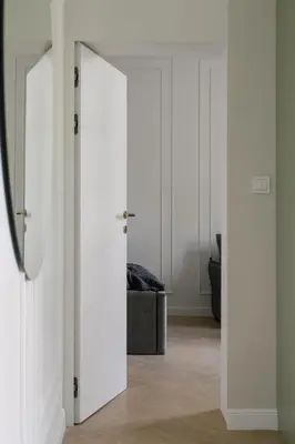 an open door in a room with a couch at Wawel View I Koletek 17 in Kraków