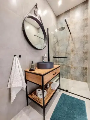 a bathroom with a sink and a shower at Meiselsa Apartments by Noah in Kraków