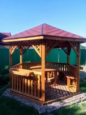 a wooden gazebo with a table and a roof at Kwatery pracownicze Kęty Zielona in Kęty
