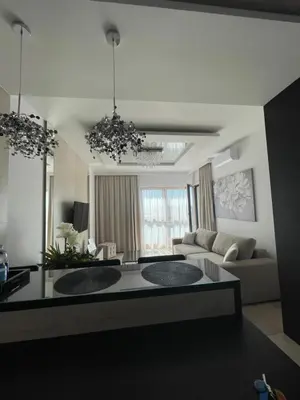 a living room with a couch and a table at Crystal Luxury Apartments Rakowicka in Kraków