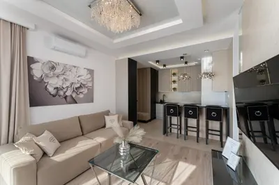 a living room with a couch and a glass table at Crystal Luxury Apartments Rakowicka in Kraków