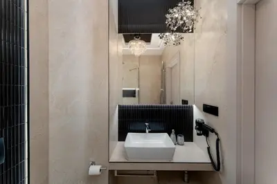 a bathroom with a sink and a mirror at Crystal Luxury Apartments Rakowicka in Kraków