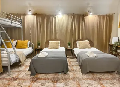 a room with two beds in a room at Apartment for 12 guests in city center in Kraków
