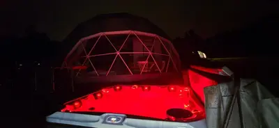 a red bath tub with a red light on it at Aqua Glamp in Jaszczurowa