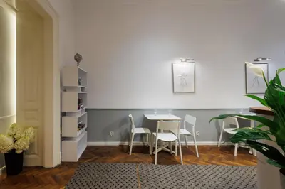 a dining room with a table and chairs at Malila Premium Aparthotel Sebastiana 20 Old Town in Kraków