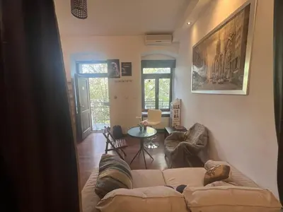 a living room with a couch and a table at Lets go in Kraków