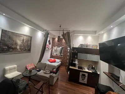 a living room with a couch and a table at Lets go in Kraków