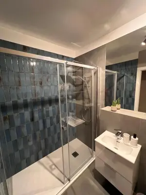 a bathroom with a shower and a sink at Apartament Dominikanów 28m36 in Kraków