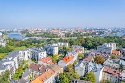 an aerial view of a city with buildings at Kraków Dębniki - Vistula River & Parks nearby in Kraków
