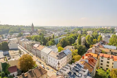 an overhead view of a city with buildings and trees at Kraków Dębniki - Vistula River & Parks nearby in Kraków
