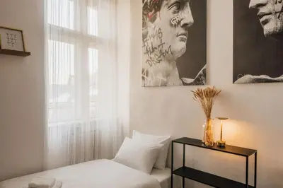 a bedroom with a bed and a window at dreamfactory - Hostel Krakow in Kraków