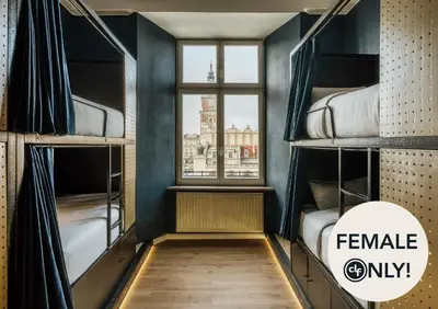 a room with bunk beds with a window at dreamfactory - Hostel Krakow in Kraków