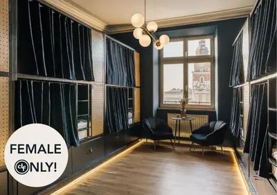 a room with windows with chairs and a table at dreamfactory - Hostel Krakow in Kraków