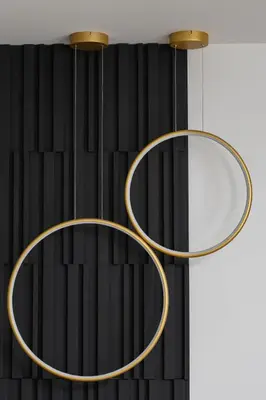 two round mirrors hanging from a black wall at Modern Prestige Apartment with Parking in Kraków by Noclegi Renters in Kraków