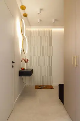 a hallway with a mirror on the wall at Modern Prestige Apartment with Parking in Kraków by Noclegi Renters in Kraków