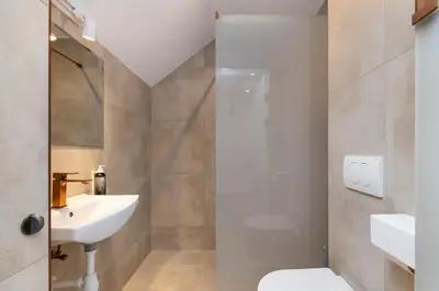 a bathroom with a toilet and a sink at Volare Balice in Cholerzyn