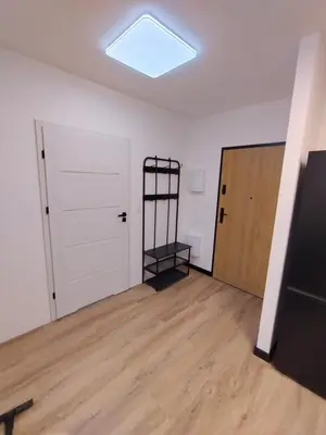 an empty room with a door and a shelf at Podłęże Trawniki Industrial Zone